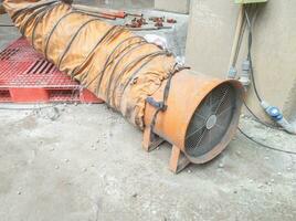 Air blowers with proboscis are used to blow air when working in confined space areas photo