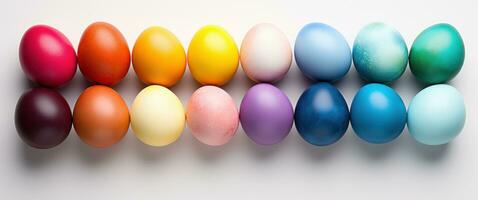 AI generated colorful easter eggs in rainbow, floral arrangement, and white background photo