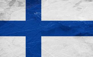 Flag of Republic of Finland on a textured background. Concept collage. photo