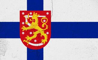 Flag and coat of arms of Republic of Finland on a textured background. Concept collage. photo