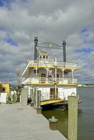 Alexandria, VA, USA 2023. Paddle steamer on the Potomac river in Old Town waterfront in Alexandria VA photo