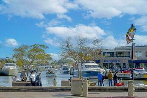Annapolis, MD, USA 2023. People walking around the waterfront dock area in Annapolis MD photo