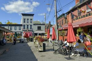 Annapolis, MD, USA 2023. People dining outside a cafe at Market Place in Annapolis , MD photo