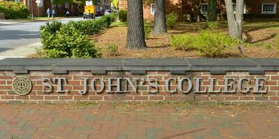 St. John's College campus, Annapolis, Maryland, USA, 2023. Campus entrance sign on the brick wall. photo