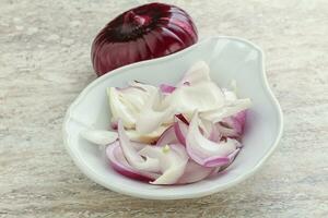 Sliced red onion in the bowl photo