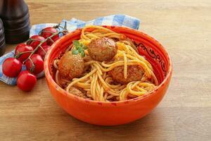 Spaghetti with meatball in tomato sause photo