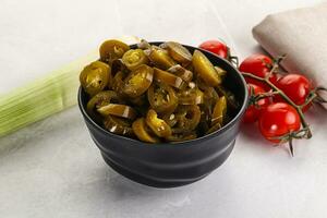 Sliced canned jalapeno pepper photo