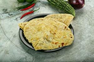 Indian tandori bread - naan with cheese photo