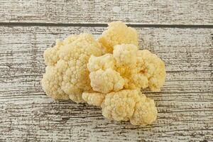 Raw white cauliflower cabbage heap photo