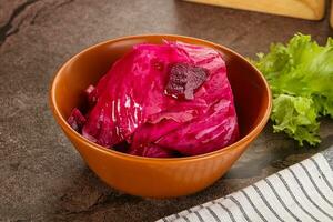 Red pickled cabbage with beetroot photo