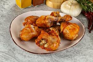 Raw marinated chicken drumstick for cooking photo