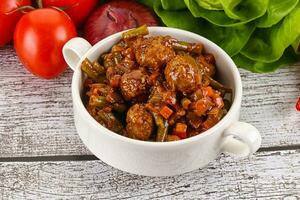 Meatball with vegetables and spices photo