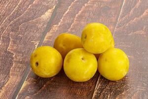 Yellow sweet plum heap fruit photo