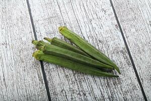 Green ripe tasty okra tropical vegetable photo