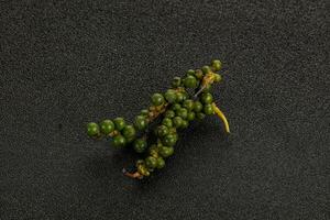 Green pepper corn heap isolated photo