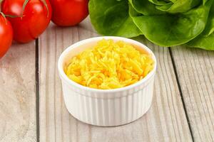 Shredded cheese in the bowl photo