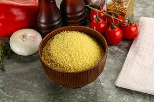 Raw dry wheat couscous grain photo