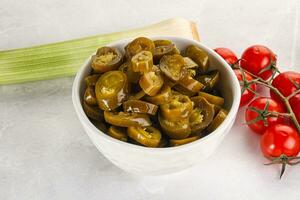 Sliced canned jalapeno pepper photo