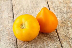 Ripe yellow bright juicy tomato photo