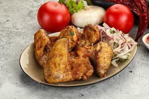 Grilled chicken wings with sauce photo