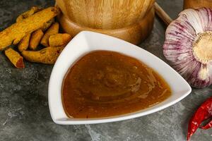 Indian curry sauce in the bowl photo