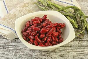 Baked red canned bean in the bowl photo