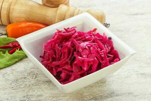 Marinated cabbage with beetroot and spices photo