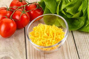 Shredded cheese in the bowl photo