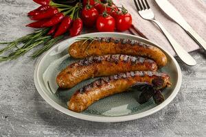 Grilled meat sausages with spices photo