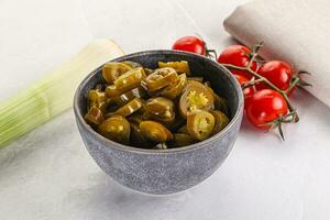 Sliced canned jalapeno pepper photo