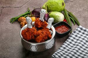 Indian cuisine glazed chicken lollipop photo