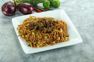 Stir fried noodles with beef photo