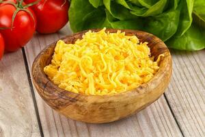 Shredded cheese in the bowl photo