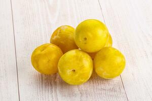 Yellow sweet plum heap fruit photo