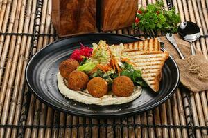 Israeli Falafel with hummus with bread photo