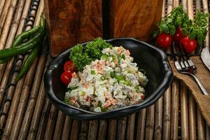 Traditional Russian salad with mayonnaise photo