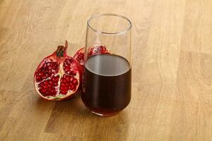 Sweet pomegranate juice in glass photo