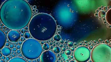 Abstract Colorful Food Oil Drops Bubbles and spheres Flowing on Water Surface photo