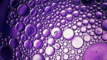 Abstract Colorful Food Oil Drops Bubbles and spheres Flowing on Water Surface photo