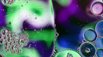 Abstract Colorful Food Oil Drops Bubbles and spheres Flowing on Water Surface photo