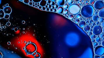 Abstract Colorful Food Oil Drops Bubbles and spheres Flowing on Water Surface photo