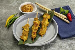 Thai meat skewer Satay with sauce photo