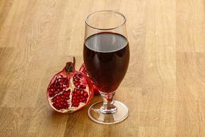 Sweet pomegranate juice in glass photo