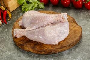 Raw chicken leg foe cooking photo