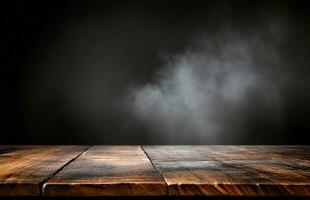 Old wooden table with smoke on dark background photo