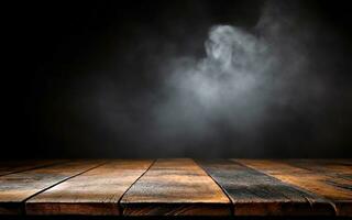 Old wooden table with smoke on dark background photo