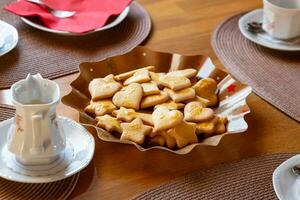 a table set for christmas with cookies photo