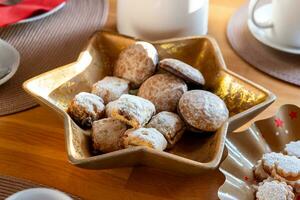 a table set for christmas with gingerbread photo