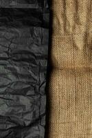 Burlap fabric texture and black crumpled paper. Rough vintage back photo