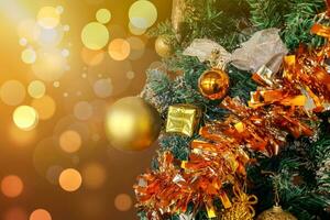 Close up of christmas tree with decorations, copy space area, and blur light background. photo